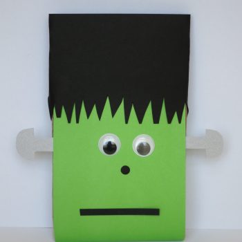 To make a Microwave Popcorn Frankenstein, you need: a package of microwave popcorn, cardstock or construction paper (green, black and silver/grey), large googly eyes, scissors, hole punch, and glue.