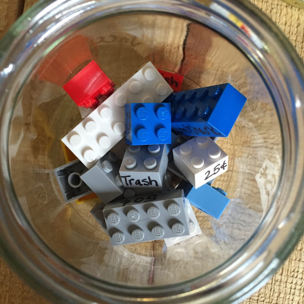 Your kids will be learning money, doing chores, saving money, & having fun with is interactive Lego chore chart.