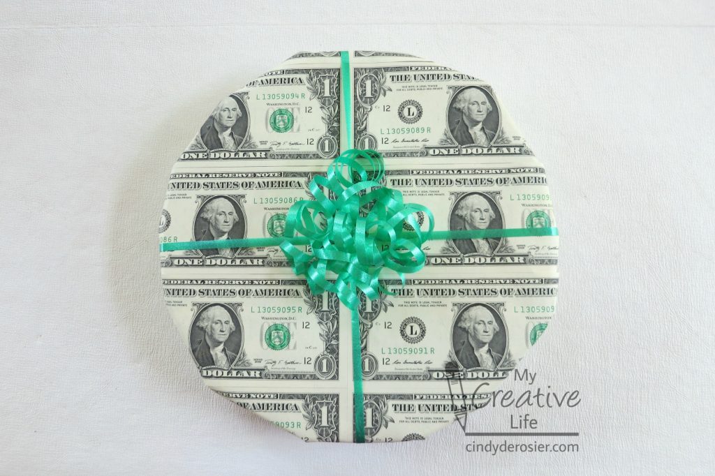 Make your gift even more memorable by wrapping it with dollar bills!