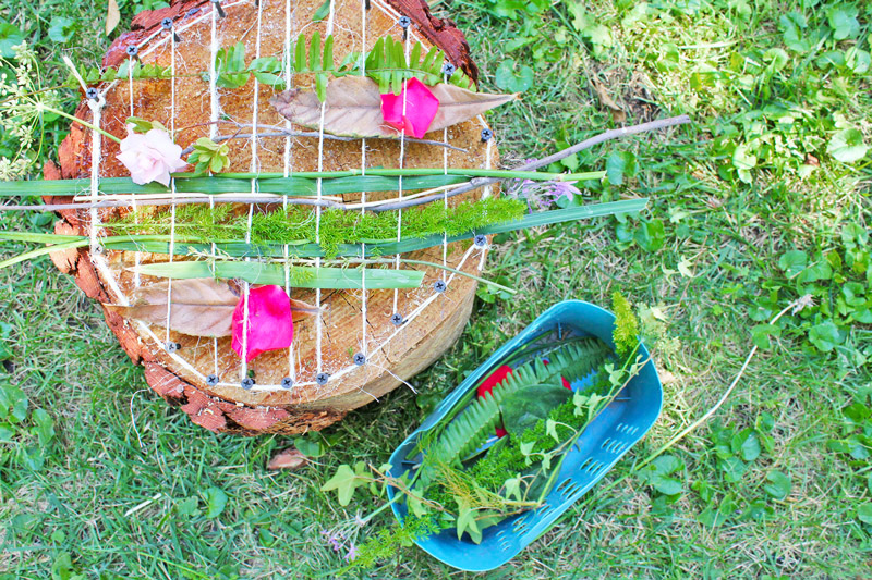 Turn a tree stump into a loom that is woven outdoors with natural materials.