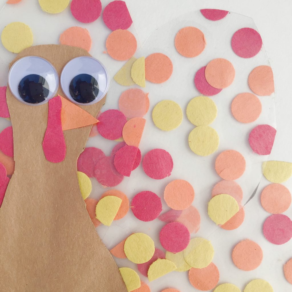 This fine motor turkey kids craft is fun for all ages! This Thanksgiving day craft is fun to create and adds a cute flare to your windows or fridge for the season. Great craft to keep the kids busy while mom is busy cooking.