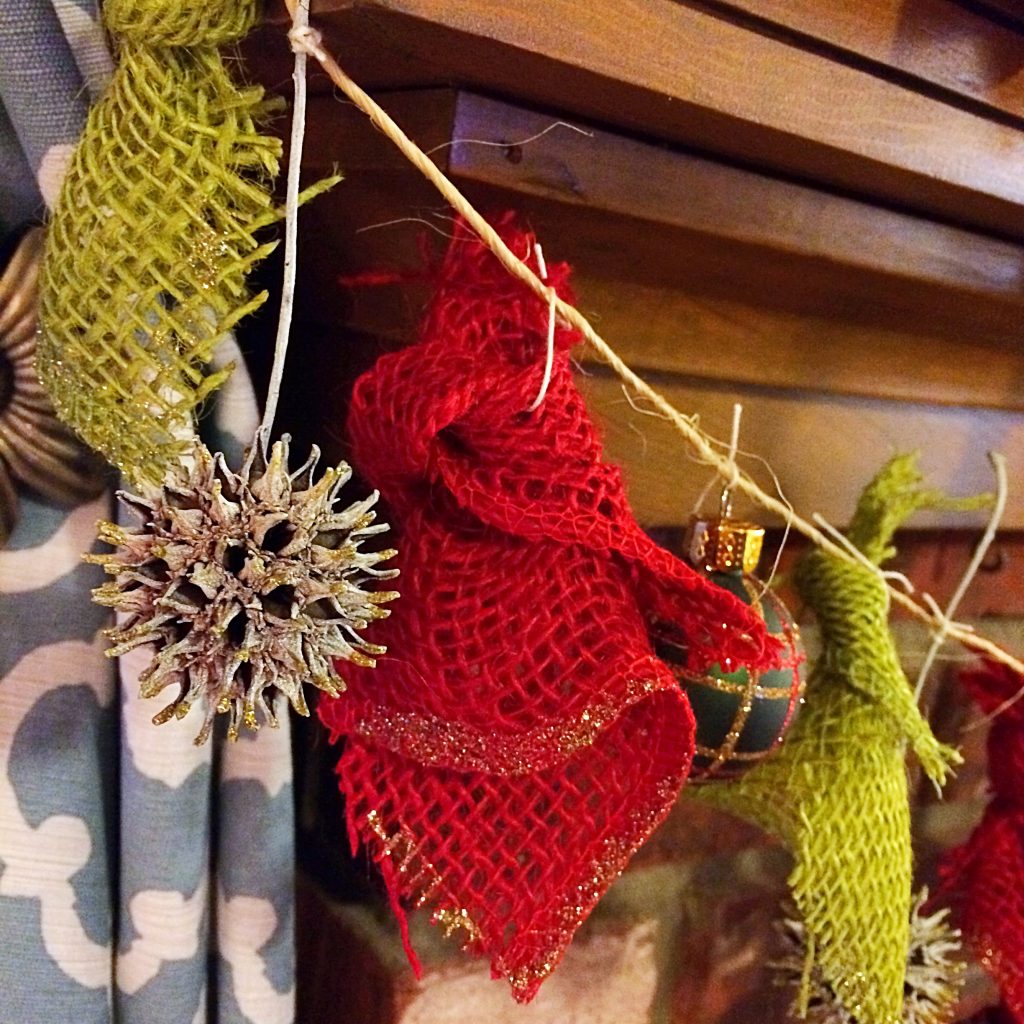 DIY Christmas Garland. Simple rustic and natural garland made from sweetgum balls, inexpensive Christmas ornaments, and burlap.