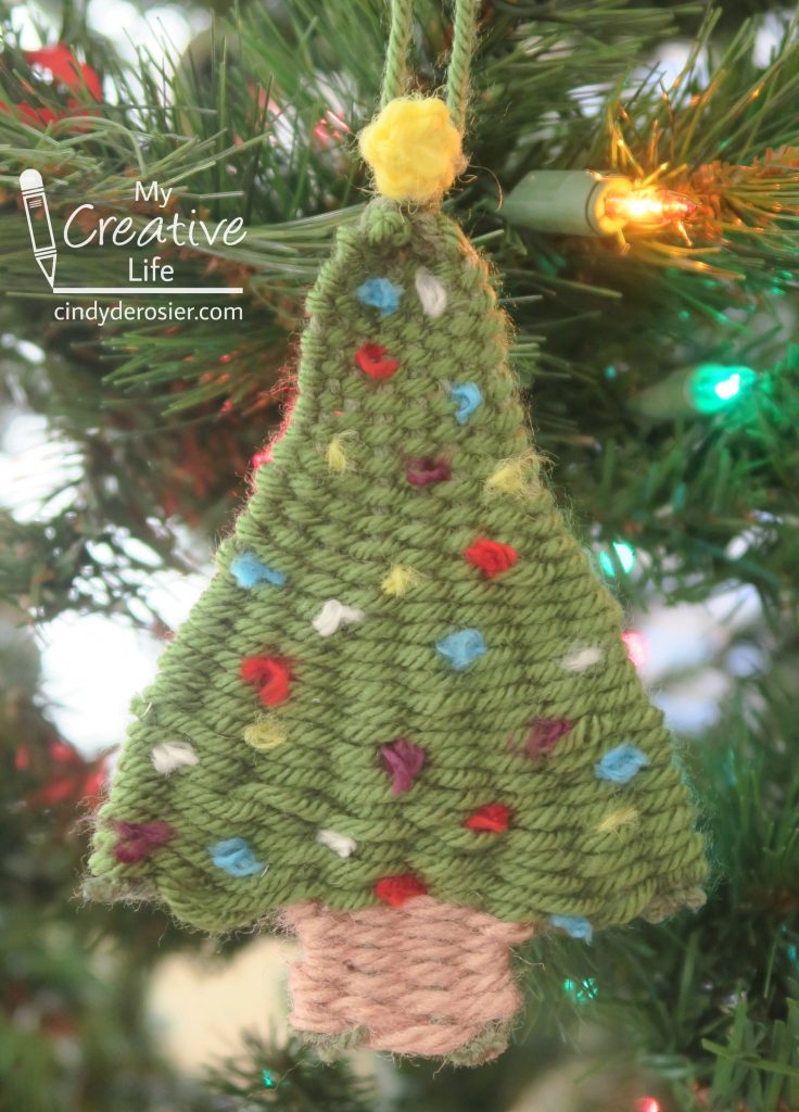 This woven tree ornament is made entirely of yarn (no glue!)